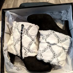 Black Dress boots with faux fur around top. High heel